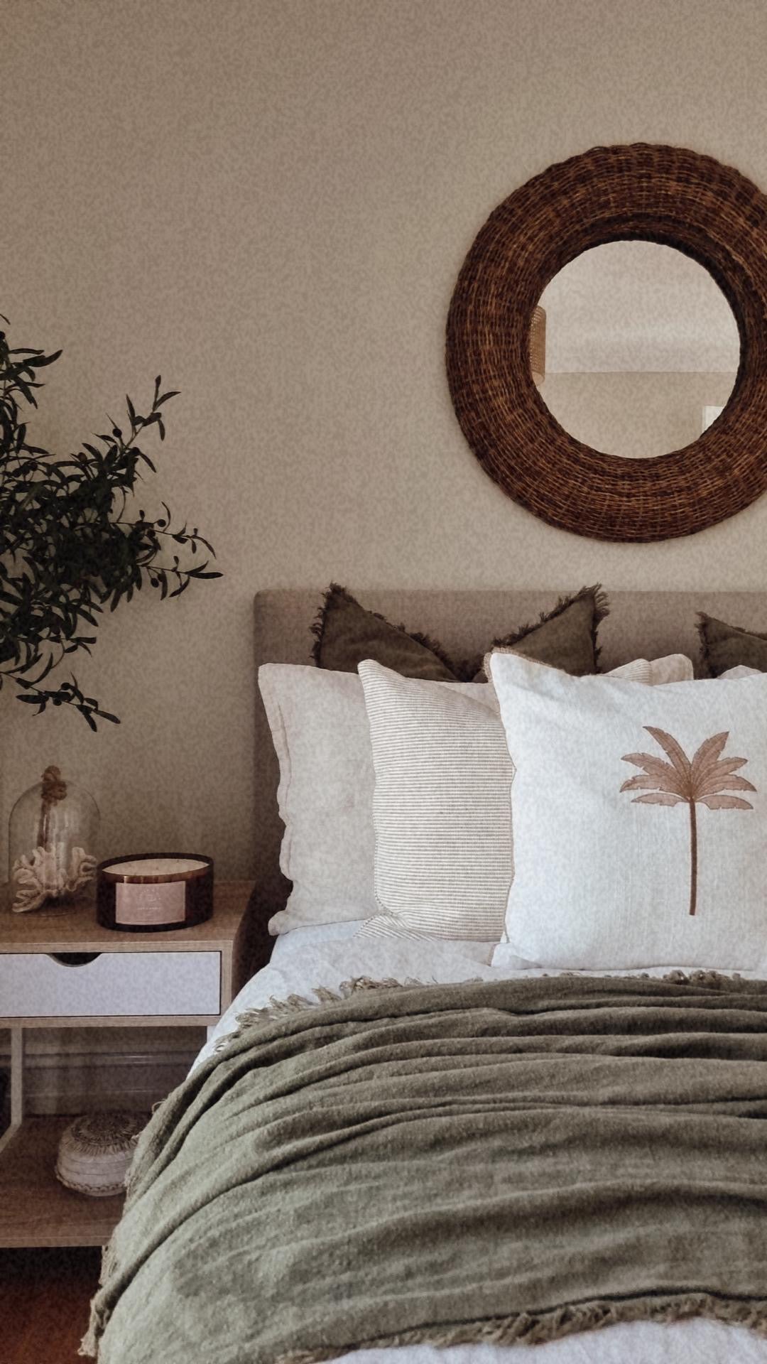 Beautiful Neutral bedroom with a premium candle bowl on the bedside table