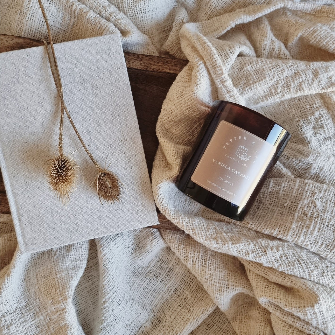 Luxury Soy Candle on blanket with book